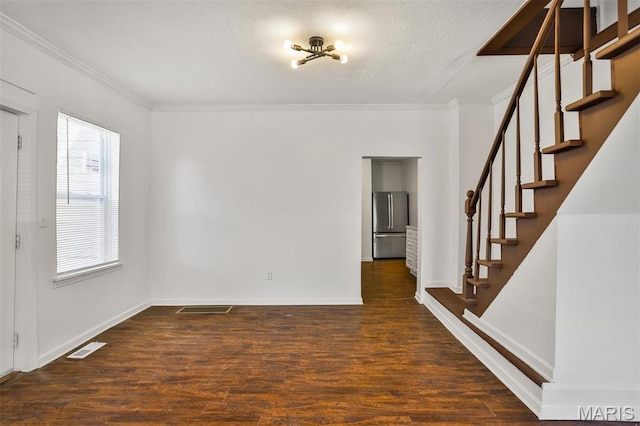 7613 Virginia Ave, Saint Louis, MO 63111 - spare room with crown molding, stairway, wood finished floors, baseboards, and a textured ceiling