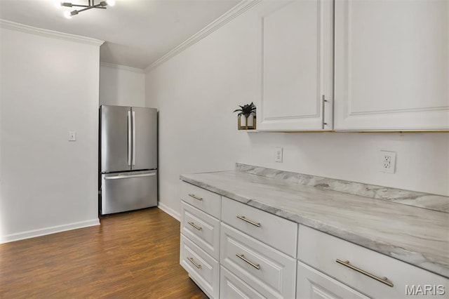 7613 Virginia Ave, Saint Louis, MO 63111 - kitchen featuring freestanding refrigerator, crown molding, baseboards, dark wood-style floors, and white cabinets