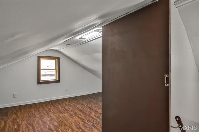 7613 Virginia Ave, Saint Louis, MO 63111 - bonus room featuring vaulted ceiling, dark wood finished floors, and baseboards