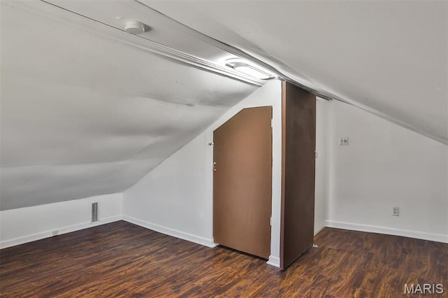7613 Virginia Ave, Saint Louis, MO 63111 - additional living space with lofted ceiling, wood finished floors, and baseboards
