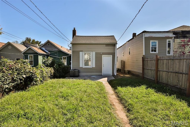 7613 Virginia Ave, Saint Louis, MO 63111 - rear view of property featuring central AC unit and a chimney