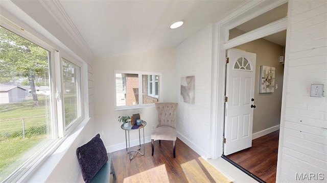 5714 Rhodes Ave, Saint Louis, MO 63109 - sitting room featuring wood finished floors, baseboards, lofted ceiling, and crown molding