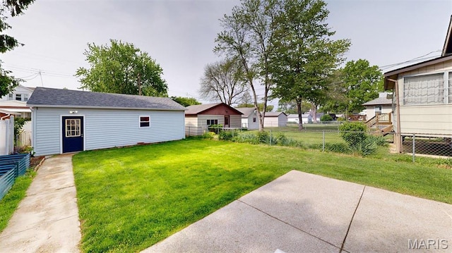 5714 Rhodes Ave, Saint Louis, MO 63109 - view of yard featuring a patio area, an outbuilding, and a residential view