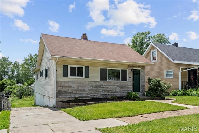 7026 Winona Ave, Saint Louis, MO 63109 - view of front of home with a chimney, a front lawn, and stone siding