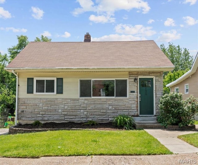 7026 Winona Ave, Saint Louis, MO 63109 - view of front of home with stone siding, a chimney, a front yard, and roof with shingles