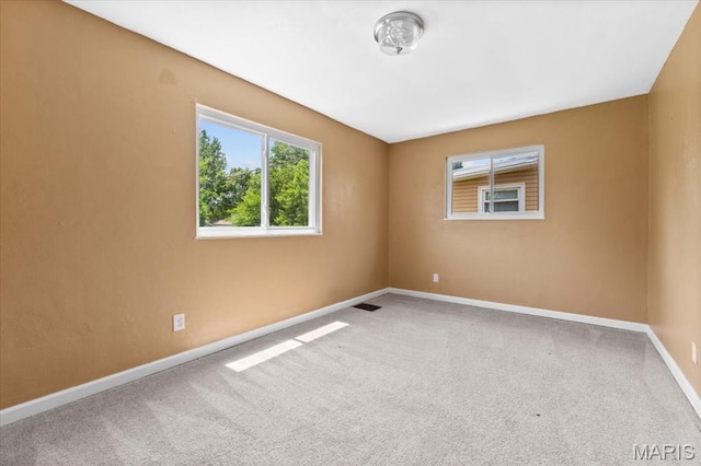 7026 Winona Ave, Saint Louis, MO 63109 - carpeted spare room featuring baseboards