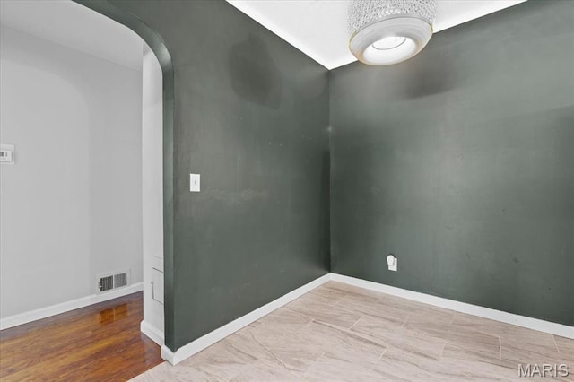 7026 Winona Ave, Saint Louis, MO 63109 - empty room with arched walkways and baseboards
