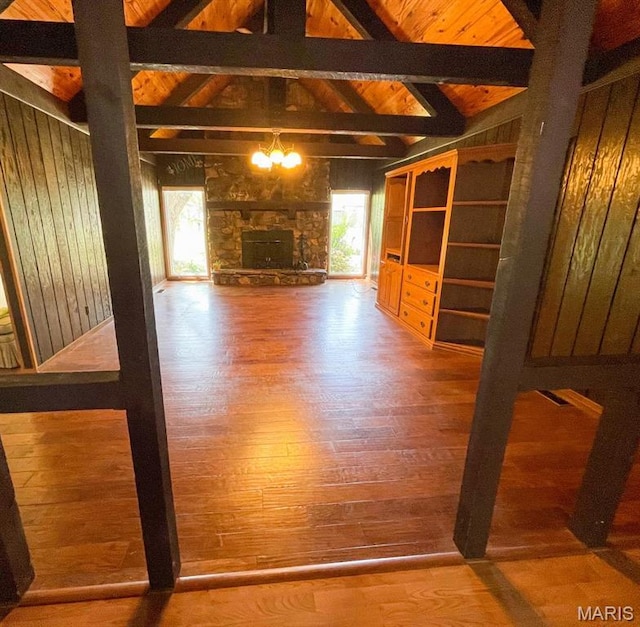 39988 Billy Blvd, Campbell, MO 63933 - unfurnished living room featuring wood finished floors, wood ceiling, a chandelier, and wooden walls
