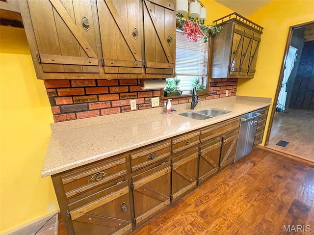 39988 Billy Blvd, Campbell, MO 63933 - kitchen featuring a sink, dark wood finished floors, dishwasher, and brown cabinetry