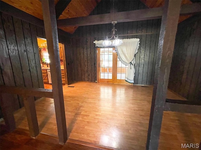 39988 Billy Blvd, Campbell, MO 63933 - unfurnished dining area featuring a chandelier, wood finished floors, and wood walls