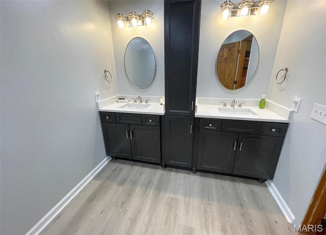 39988 Billy Blvd, Campbell, MO 63933 - full bath featuring wood finished floors, vanity, and baseboards