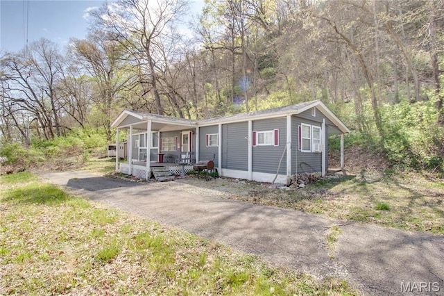 798 N Broadway, Kampsville, IL 62053 - manufactured / mobile home with a porch and asphalt driveway