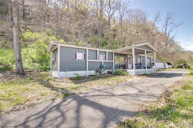 798 N Broadway, Kampsville, IL 62053 - manufactured / mobile home with covered porch and asphalt driveway