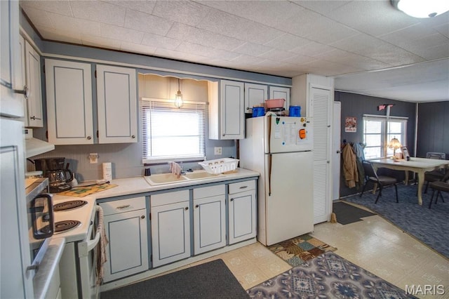 798 N Broadway, Kampsville, IL 62053 - kitchen with white appliances, light countertops, a sink, and light floors