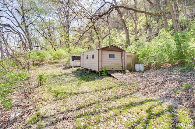 798 N Broadway, Kampsville, IL 62053 - view of outbuilding featuring an outdoor structure and a view of trees