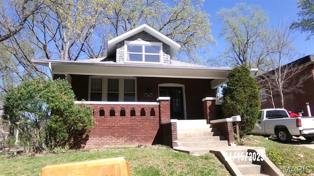 224 Voss Pl, Belleville, IL 62220 - view of front facade featuring a porch and brick siding