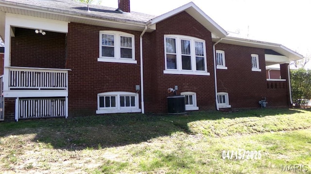 224 Voss Pl, Belleville, IL 62220 - view of property exterior with brick siding, a chimney, a lawn, and cooling unit