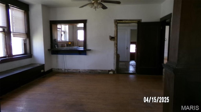 224 Voss Pl, Belleville, IL 62220 - empty room with healthy amount of natural light, wood finished floors, and a ceiling fan