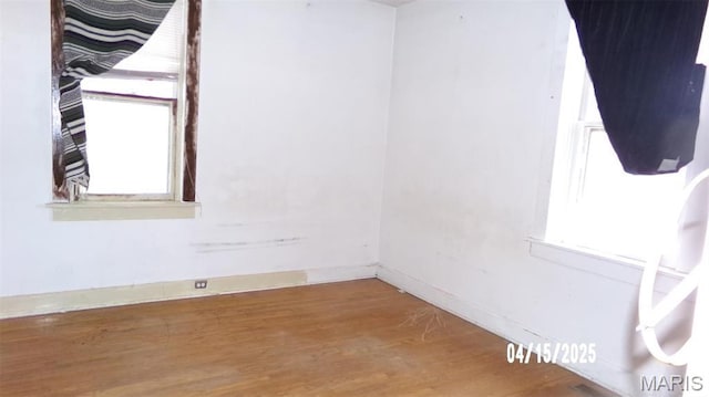 224 Voss Pl, Belleville, IL 62220 - unfurnished room with wood finished floors, healthy amount of natural light, and baseboards