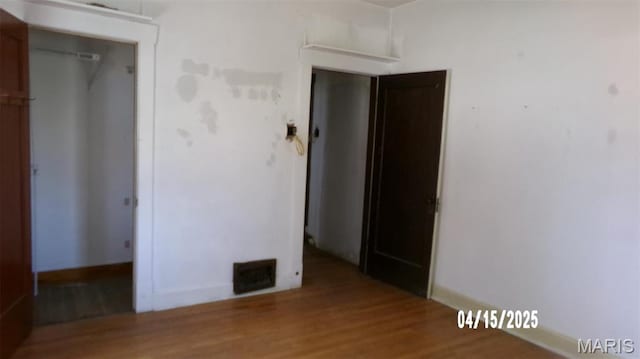 224 Voss Pl, Belleville, IL 62220 - unfurnished bedroom featuring wood finished floors, a closet, and baseboards