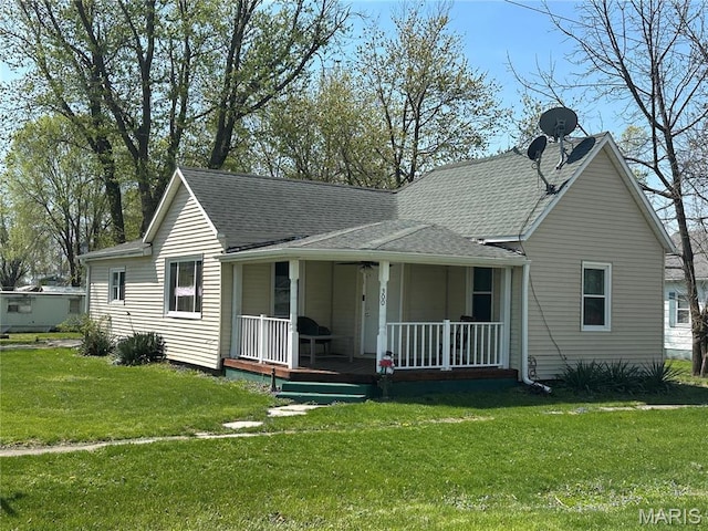 300 W 5th, New London, MO 63459 - view of front of house featuring a porch, a front lawn, and roof with shingles