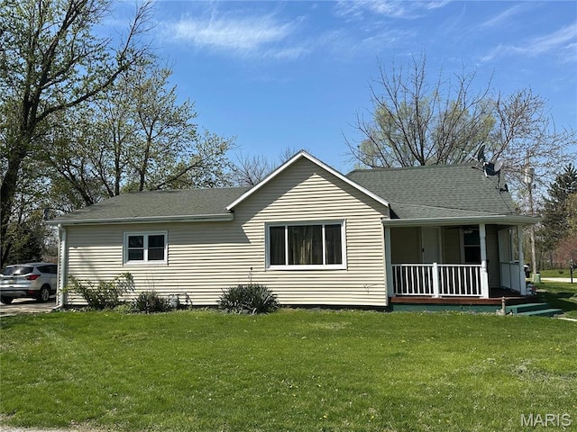 300 W 5th, New London, MO 63459 - view of front of home with a porch, a front lawn, and a shingled roof