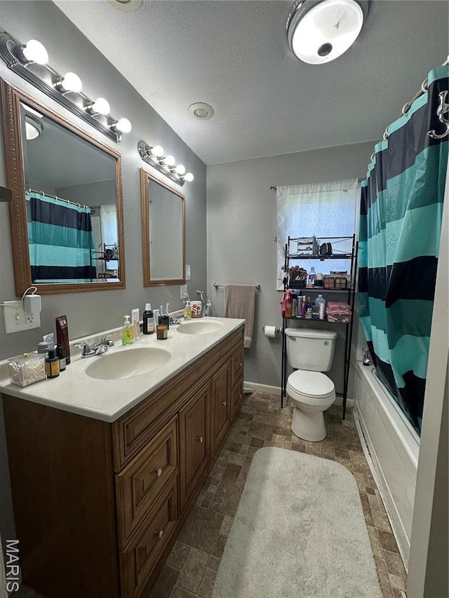 300 W 5th, New London, MO 63459 - bathroom with a textured ceiling, double vanity, toilet, and shower / bath combo