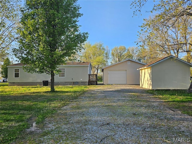 507 Ash St, Percy, IL 62272 - detached garage featuring driveway and central air condition unit