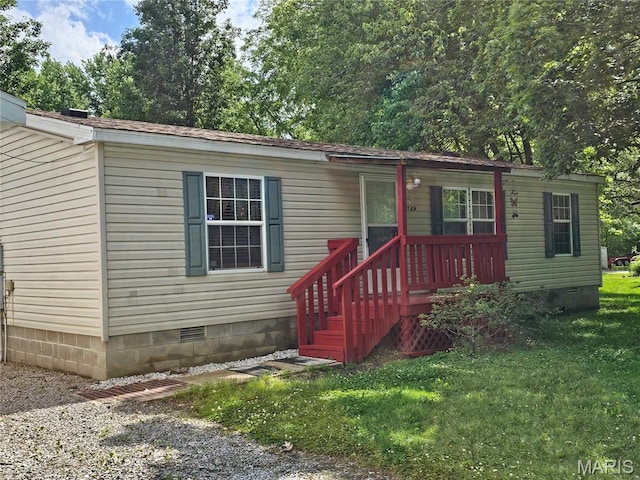 507 Ash St, Percy, IL 62272 - manufactured / mobile home with crawl space, a front lawn, and covered porch