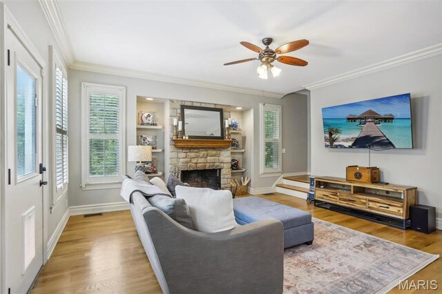 1002 Chesterfield Forest Dr, Wildwood, MO 63005 - living room featuring wood finished floors, ornamental molding, a fireplace, a ceiling fan, and baseboards