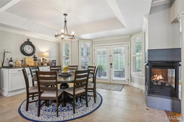 1002 Chesterfield Forest Dr, Wildwood, MO 63005 - dining area with a raised ceiling, a multi sided fireplace, ornamental molding, french doors, and a chandelier
