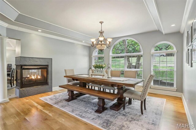 1002 Chesterfield Forest Dr, Wildwood, MO 63005 - dining room with light wood finished floors, a multi sided fireplace, a chandelier, baseboards, and recessed lighting