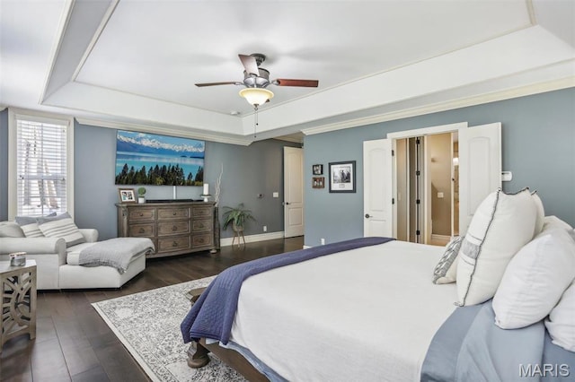 1002 Chesterfield Forest Dr, Wildwood, MO 63005 - bedroom with a raised ceiling, dark wood-style flooring, a ceiling fan, and baseboards