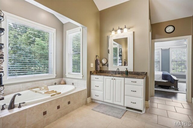 1002 Chesterfield Forest Dr, Wildwood, MO 63005 - full bath with plenty of natural light, tile patterned floors, vaulted ceiling, and a garden tub