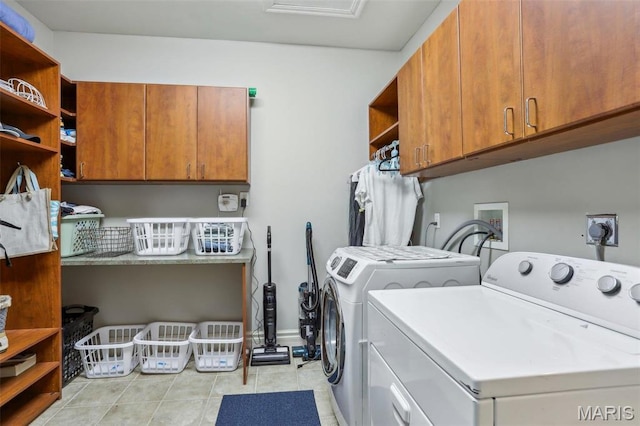 1002 Chesterfield Forest Dr, Wildwood, MO 63005 - washroom with cabinet space, washing machine and clothes dryer, and light tile patterned floors