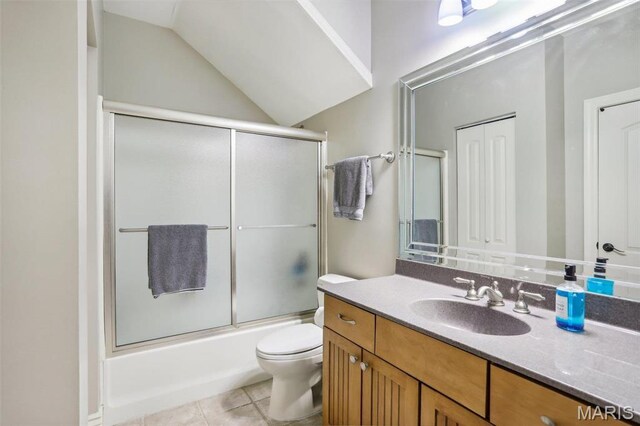 1002 Chesterfield Forest Dr, Wildwood, MO 63005 - bathroom featuring vanity, toilet, tile patterned flooring, shower / bath combination with glass door, and lofted ceiling