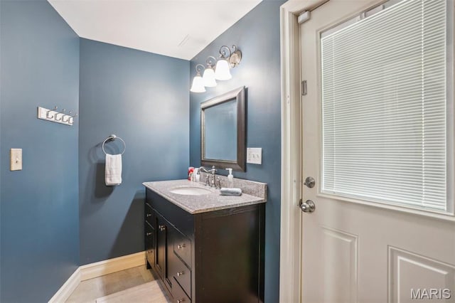 1002 Chesterfield Forest Dr, Wildwood, MO 63005 - bathroom with baseboards, vanity, and tile patterned flooring