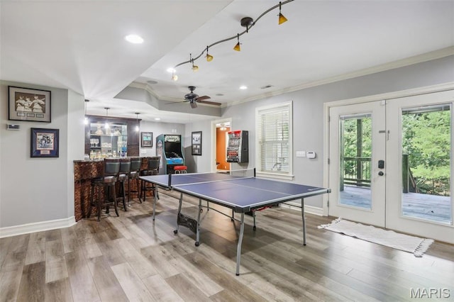 1002 Chesterfield Forest Dr, Wildwood, MO 63005 - playroom with french doors, a dry bar, ornamental molding, wood finished floors, and baseboards