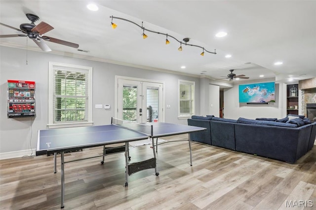 1002 Chesterfield Forest Dr, Wildwood, MO 63005 - playroom featuring ceiling fan, ornamental molding, recessed lighting, french doors, and light wood-style floors