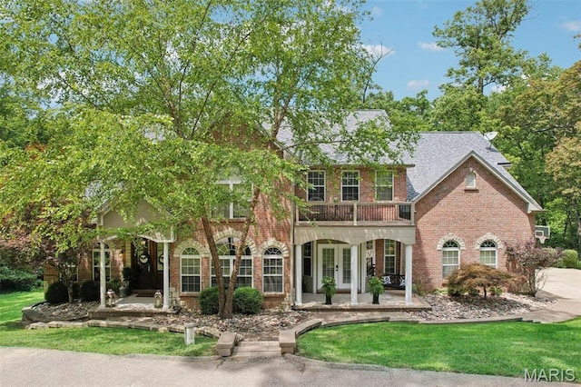 1002 Chesterfield Forest Dr, Wildwood, MO 63005 - view of front of property featuring french doors, brick siding, and a front lawn