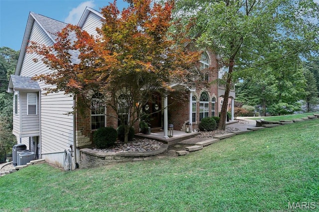 1002 Chesterfield Forest Dr, Wildwood, MO 63005 - view of side of home with a lawn, cooling unit, and a shingled roof