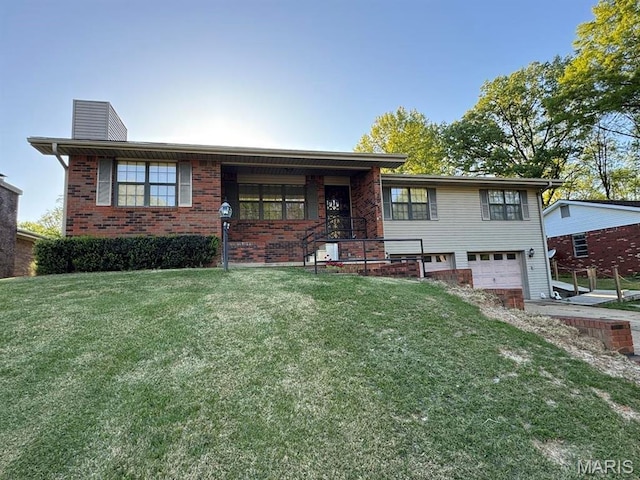 2925 Wayne Ave, Poplar Bluff, MO 63901 - view of front facade with a garage, a chimney, a front yard, and brick siding