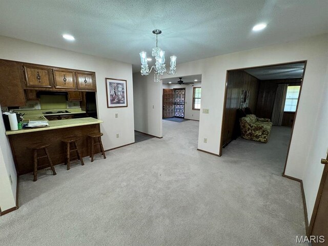 2925 Wayne Ave, Poplar Bluff, MO 63901 - dining room featuring a chandelier, light colored carpet, baseboards, recessed lighting, and a ceiling fan