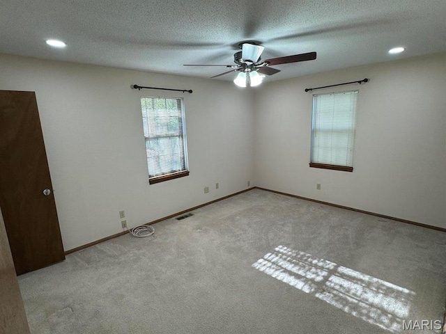 2925 Wayne Ave, Poplar Bluff, MO 63901 - carpeted empty room with ceiling fan, baseboards, recessed lighting, and a textured ceiling