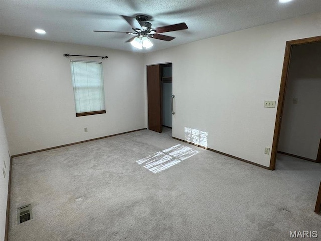 2925 Wayne Ave, Poplar Bluff, MO 63901 - unfurnished bedroom with carpet, a closet, baseboards, recessed lighting, and ceiling fan