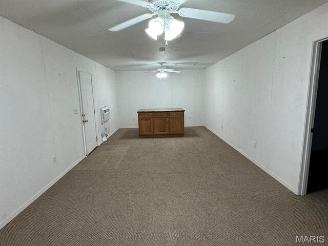 2925 Wayne Ave, Poplar Bluff, MO 63901 - empty room with a ceiling fan, carpet, heating unit, and baseboards