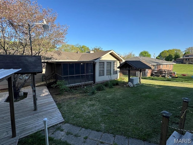 2925 Wayne Ave, Poplar Bluff, MO 63901 - rear view of house with a sunroom and a yard