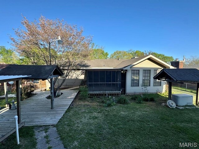 2925 Wayne Ave, Poplar Bluff, MO 63901 - rear view of property with a sunroom and a deck