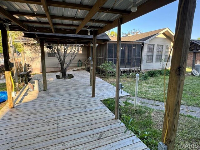 2925 Wayne Ave, Poplar Bluff, MO 63901 - dock area featuring a deck, a lawn, and central air condition unit