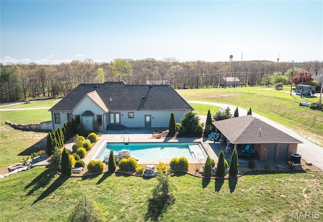 1100 Landon Rd, Bourbon, MO 65441 - view of pool featuring a patio area, a yard, and a forest view